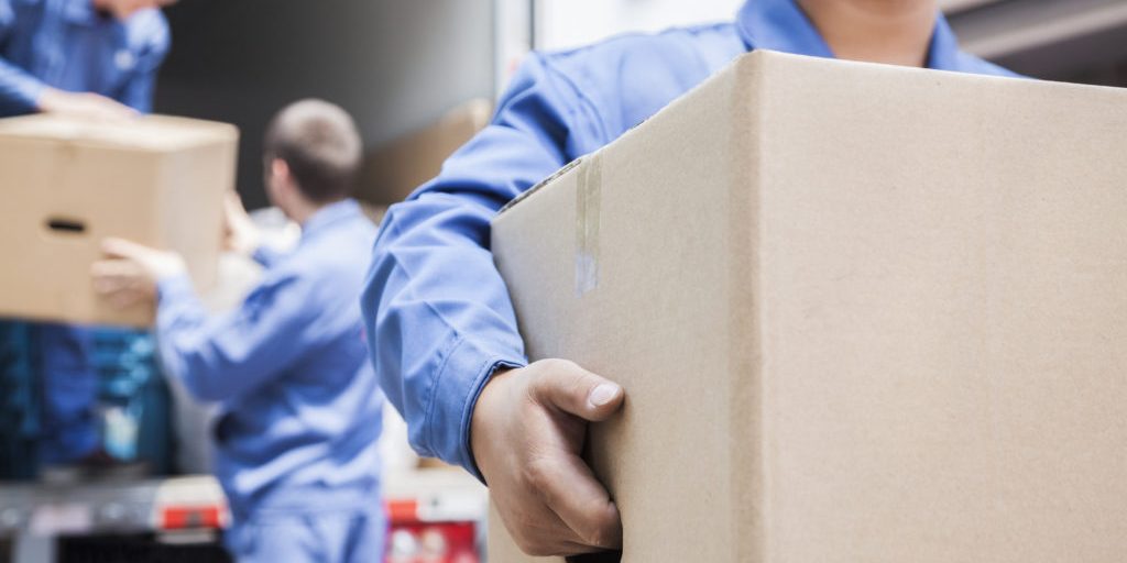 Movers unloading a moving van