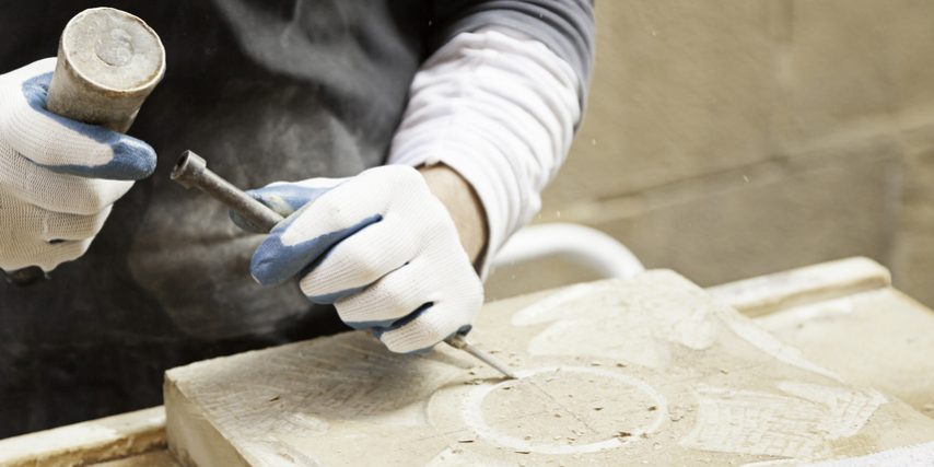 Man carving stone