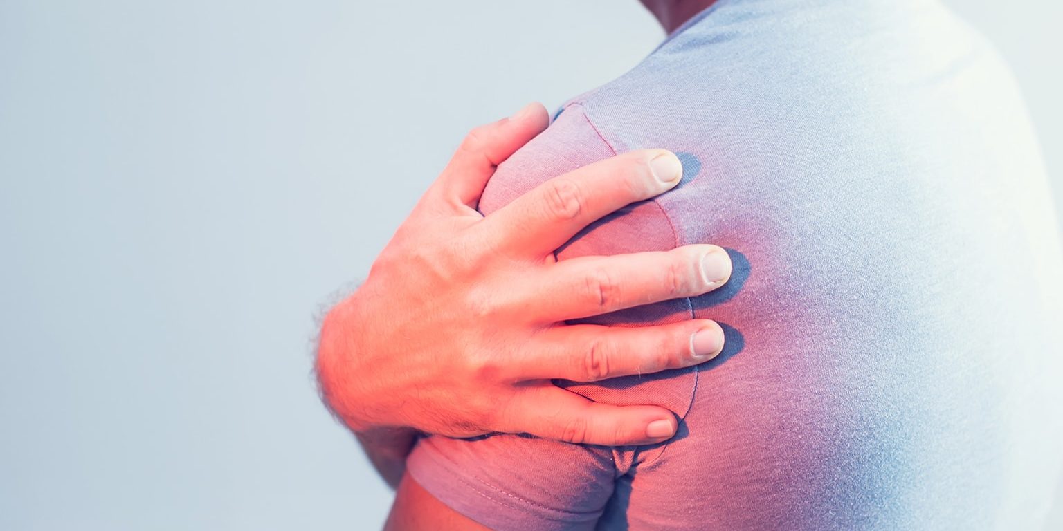 Close up of Man with shoulder pain or neck pain on white backgro